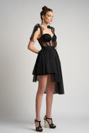 Asymmetrical dress with transparent corset