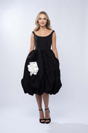 Black midi dress with white flower applique