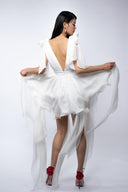 White dress with asymmetrical scarves
