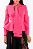Pink blazer with scarf details and a structured waist