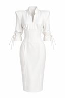 White fitted dress with structured shoulders and corset details