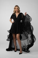 Black dress with long detachable skirt and dramatic ruffles