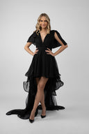 Black dress with long detachable skirt and dramatic ruffles
