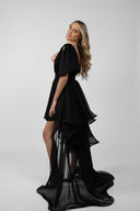 Black dress with long detachable skirt and dramatic ruffles