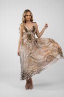 Long dress with exotic print and bare back with bow