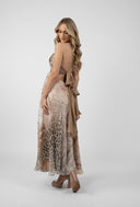 Long dress with exotic print and bare back with bow