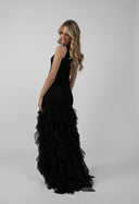 Long black dress with flowing ruffles