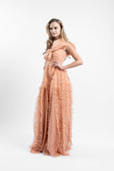 Long dress in soft tulle with ample ruffles and draped bust