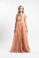 Long dress in soft tulle with ample ruffles and draped bust