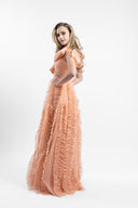 Long dress in soft tulle with ample ruffles and draped bust