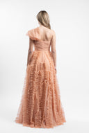Long dress in soft tulle with ample ruffles and draped bust