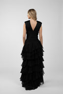 Long dress with gathered bodice and ample ruffles