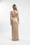 Long golden dress with sculptural drapes and front slit