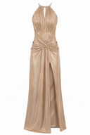 Long golden dress with sculptural drapes and front slit